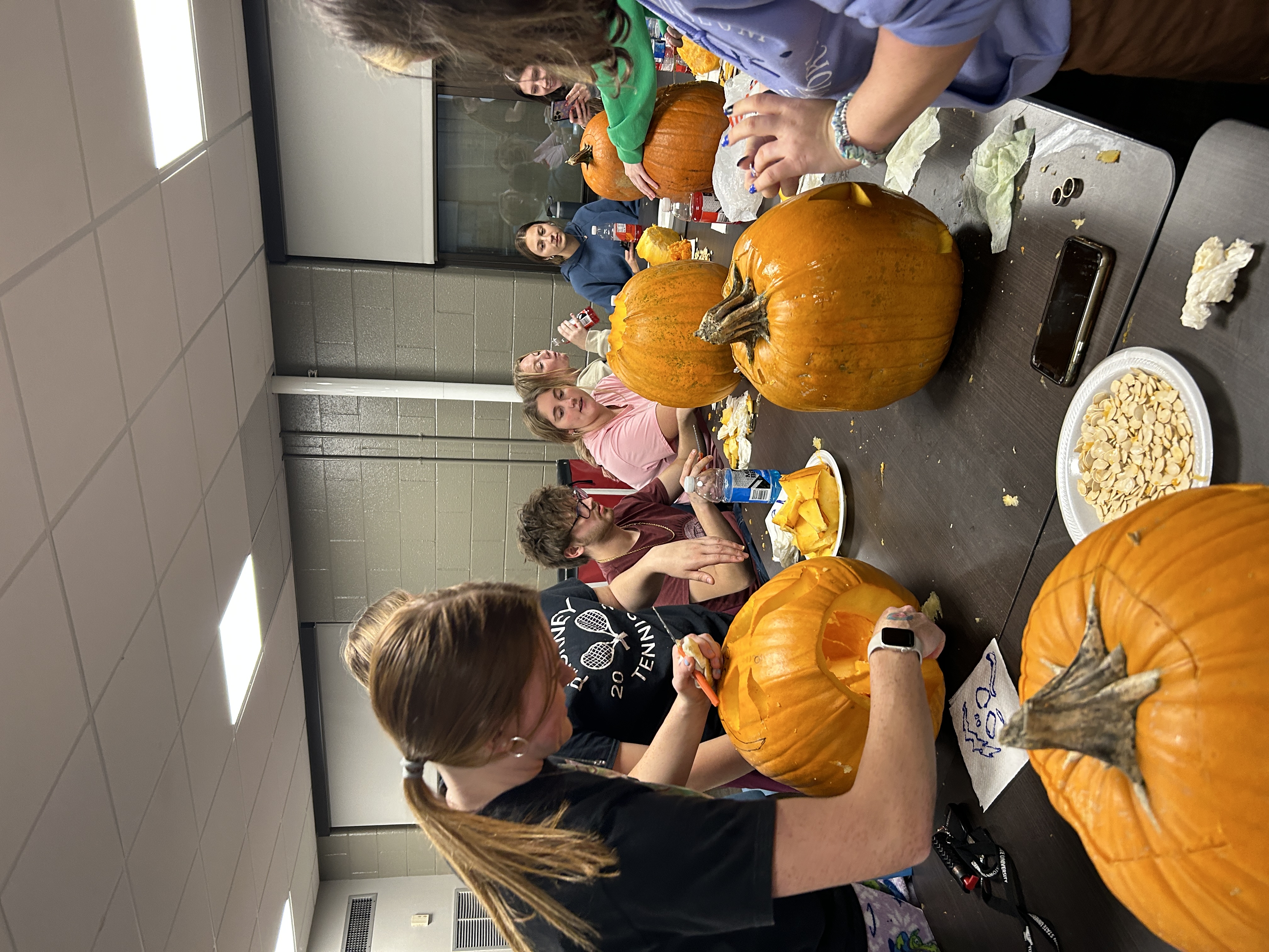 Students Carving Pumpkin