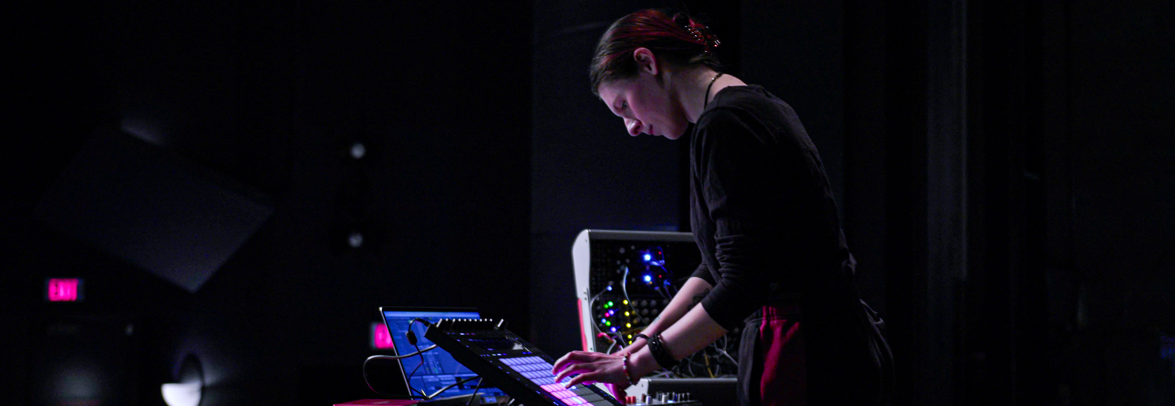 Student using audio equipment in Ford Theater 