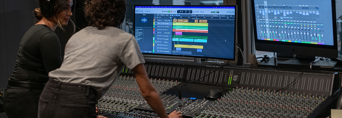 students working on music console