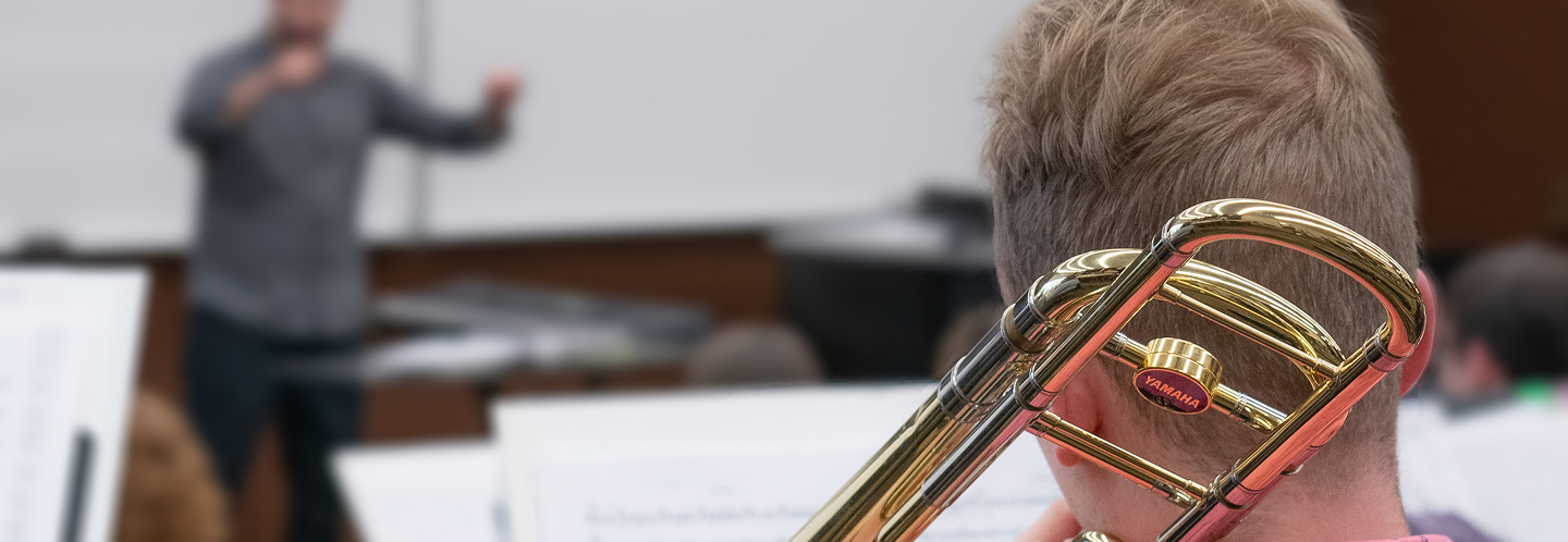 teacher and student in music class