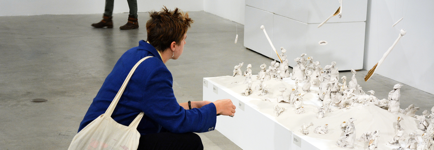 person looking at art