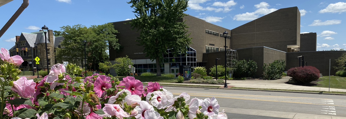 Bliss Hall with hibiscus in the summer