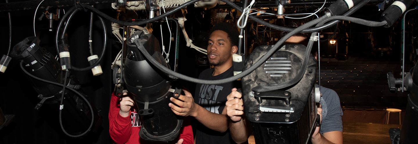 Students with lighting equipment