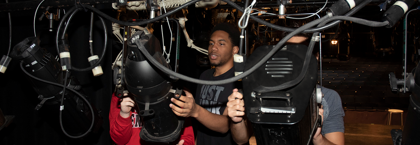 Students with lighting equipment