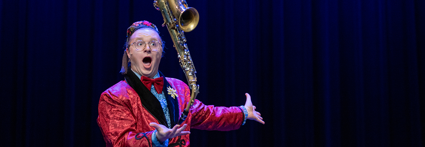 balancing a saxophone on finger