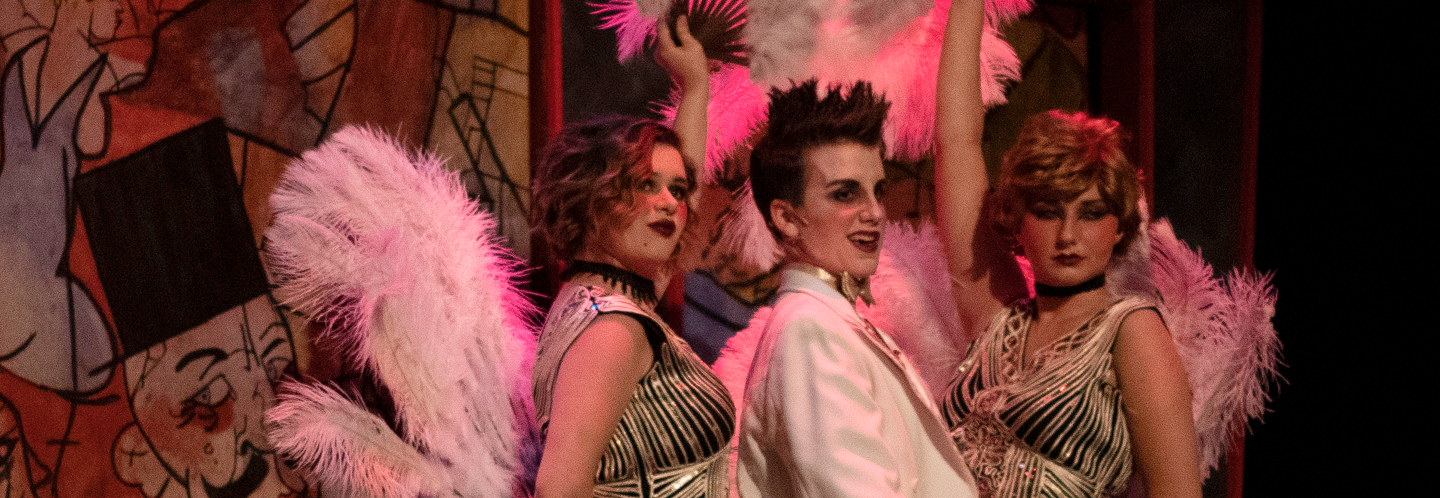 cabaret showgirls with emcee