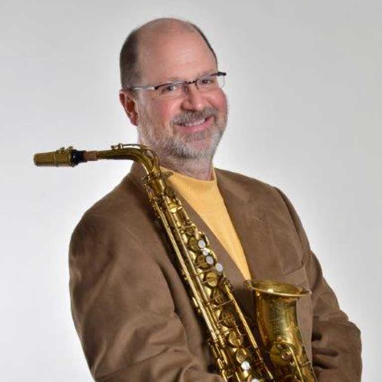 headshot of  Kent Engelhardt with saxophone