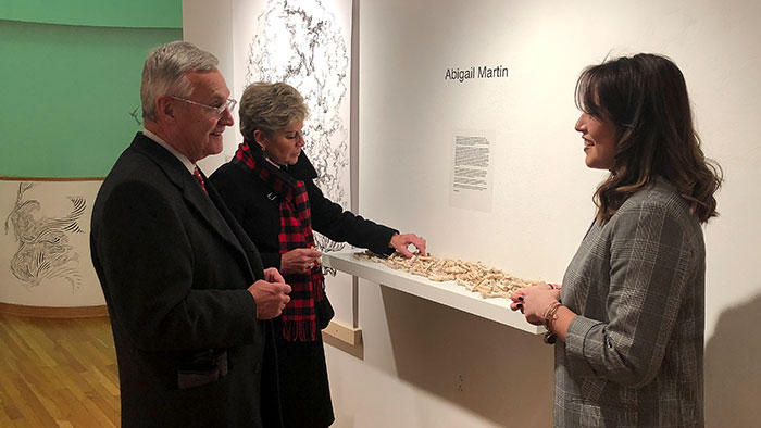 President and Mrs. Tressel touring an art exhibit by Abigail Martin.