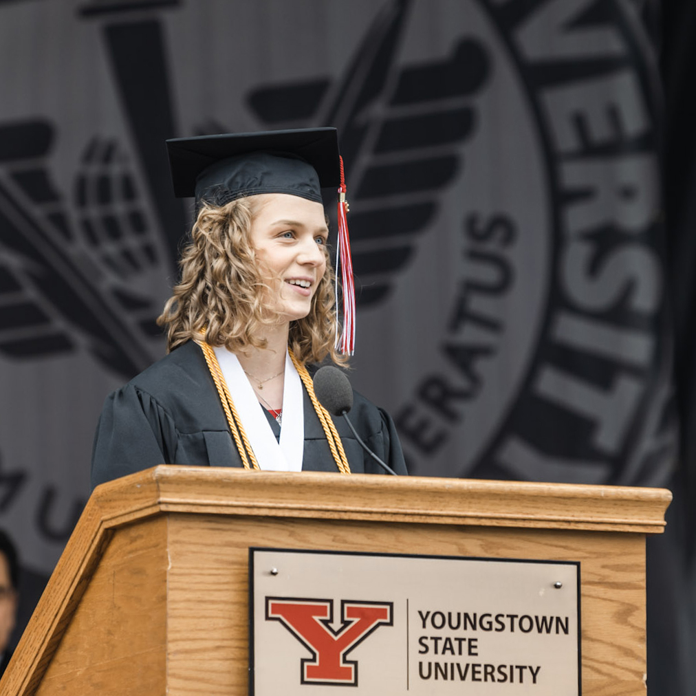 YSU Class of 2021. Congratulations Emily M. Karr, Bachelor of Music: Music Performance & Music Recording. Photo is of Emily holding grad cap