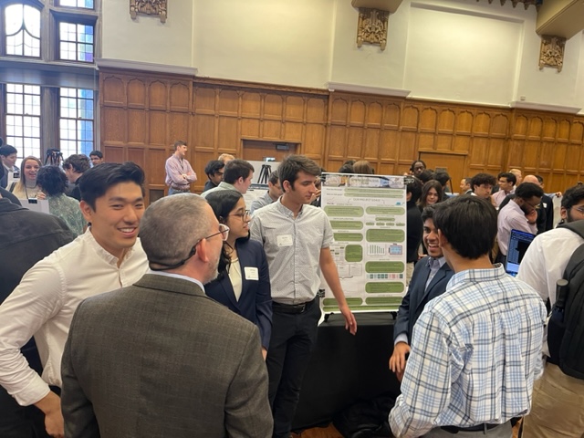 Students browse research posters at data mine symposium