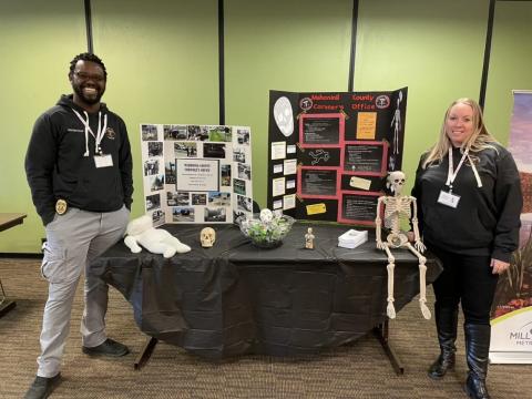 Pictured: Octavious Jones (left) and Theresa Gaetano (right) pose at an information table at Science Day 2022